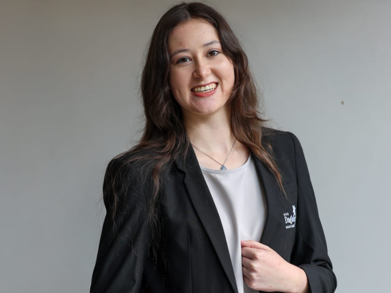 Annerine Steyn smiling in a smart suit