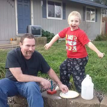 A photograph of Boyd Steel Rogers outside a house posing