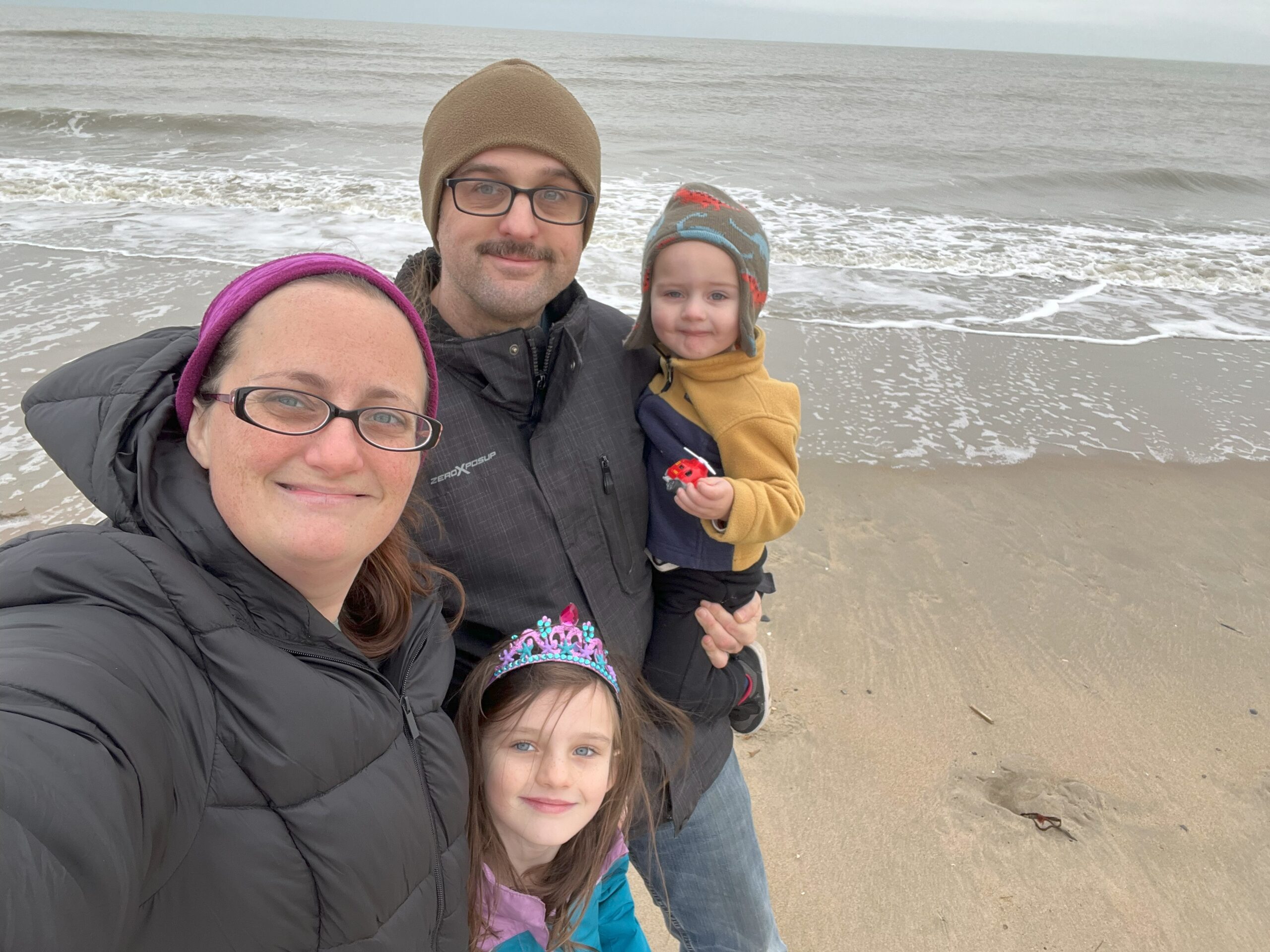 Jordan and Caleb Anders and their family on a beach