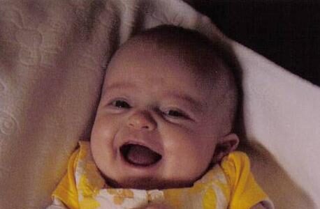 A photograph of baby Caoimhe laughing