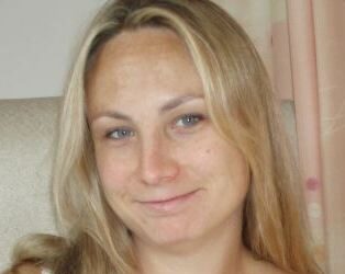 A head and shoulders photograph of Carly Fisher