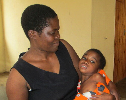 A photograph of Joyce Nayson holding her daughter Caroline