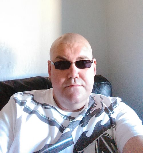 A photograph of David Dzierozynski wearing sunglasses.