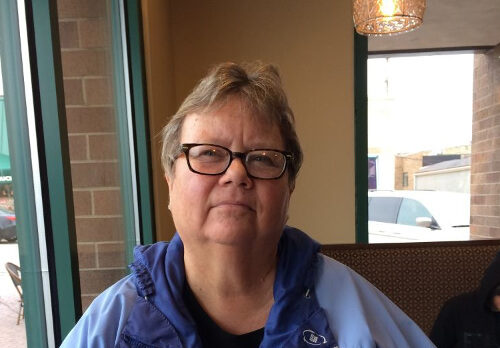 A photograph of Elizabeth Day seated indoors