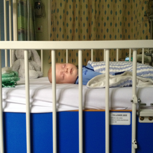 A photograph of baby Henry in a hospital bed