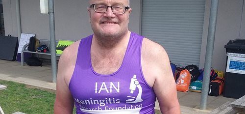 A photograph of Ian Alexander in a marathon vest