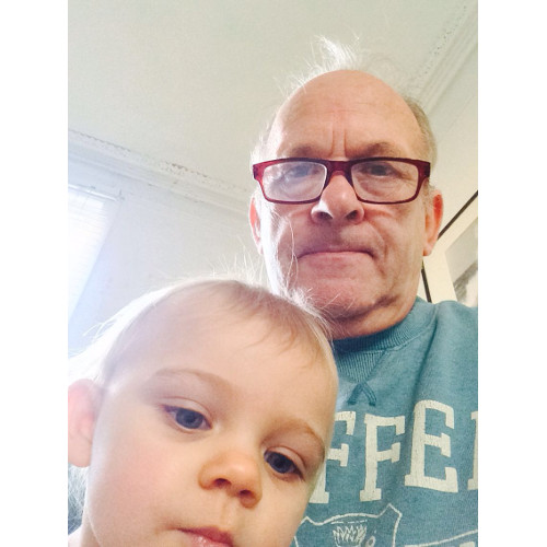 A photograph of Jack McCord and a toddler