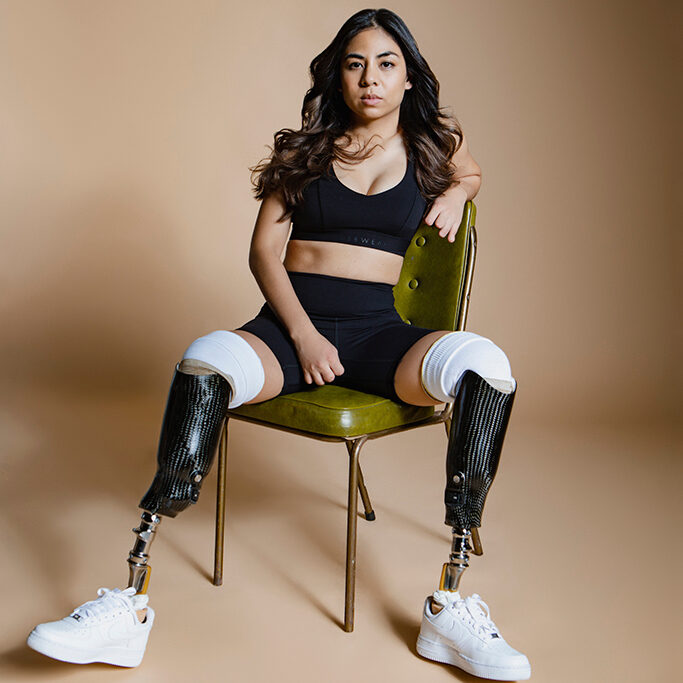 Juttima Chinnasri sat on a chair wearing prosthetic legs