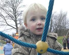 A photograph of Leo on a climbing frame