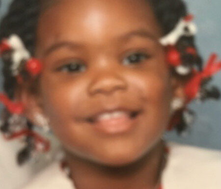 A close up photograph of toddler Monique Hopgood-Wilis