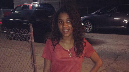 A photograph of Nyasia Soto standing outdoors