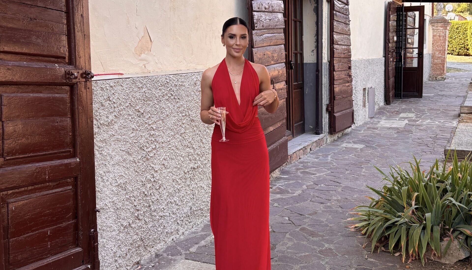 Olivia Griffiths wearing a red dress