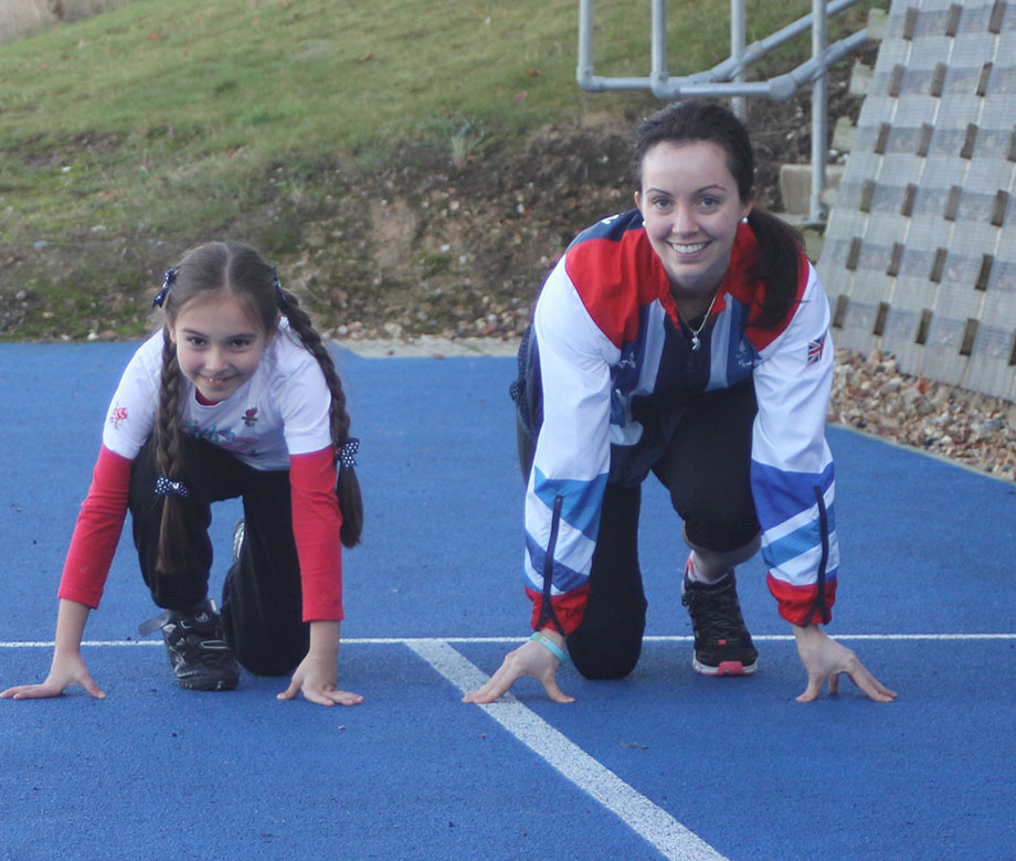 Sofia Crockatt and paralympian Stefanie Reid on a running track