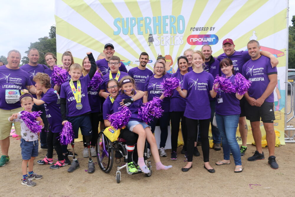 A group of fundraisers celebrating after the Superhero Triathlon.