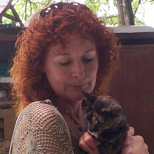 A photograph of Susan Frances Funke holding a cat