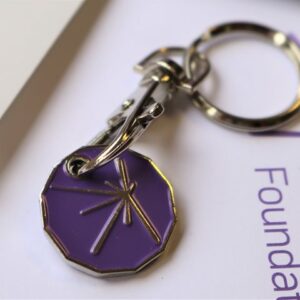 MRF branded metal trolley token