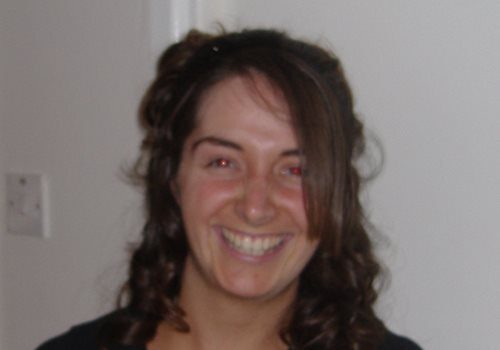 A photograph of Zoe Jeanes smiling at the camera