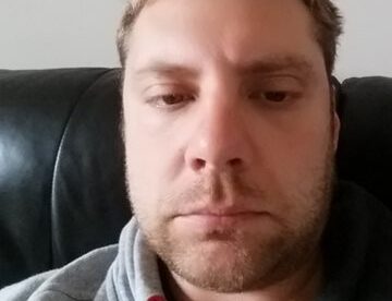 A close up photograph of Adrian Clark