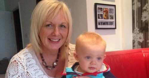 A photograph of Gina and her infant son