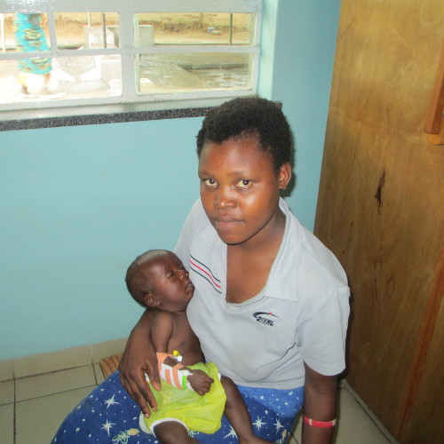 A photograph of Flora Mononga holding baby Hestings