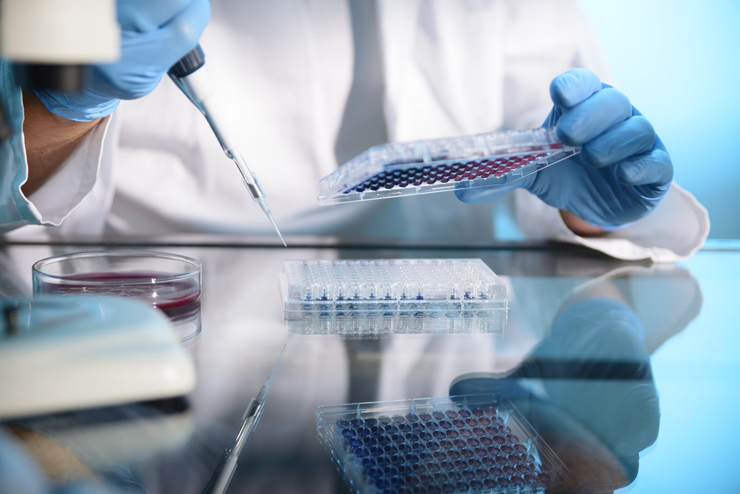 Researcher with a pipette.