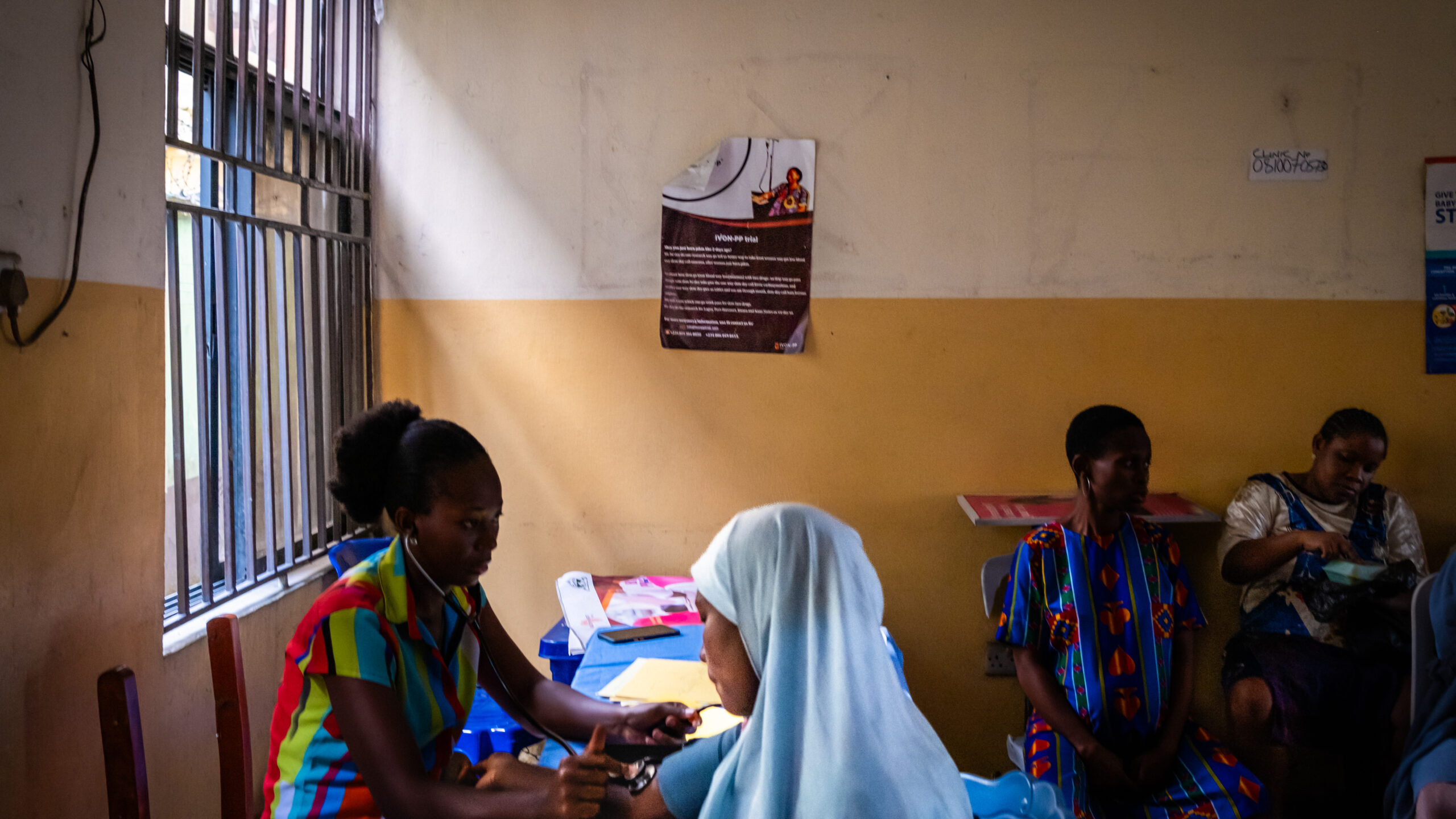 14 March 2024: Mothers receiving medical care and routine caregiver support at the Model Primary Health Care Provider in Mgbundukwu, Port Harcourt, Rivers State, Nigeria. Photograph by Daylin Paul for Meningitis Research Foundation