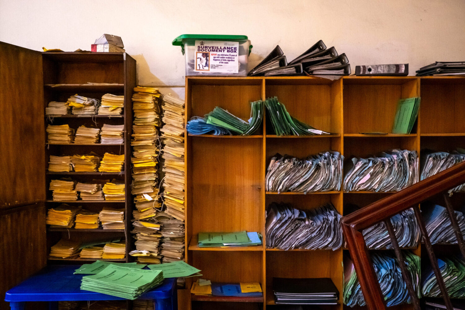 Shelves piled high with medical records.