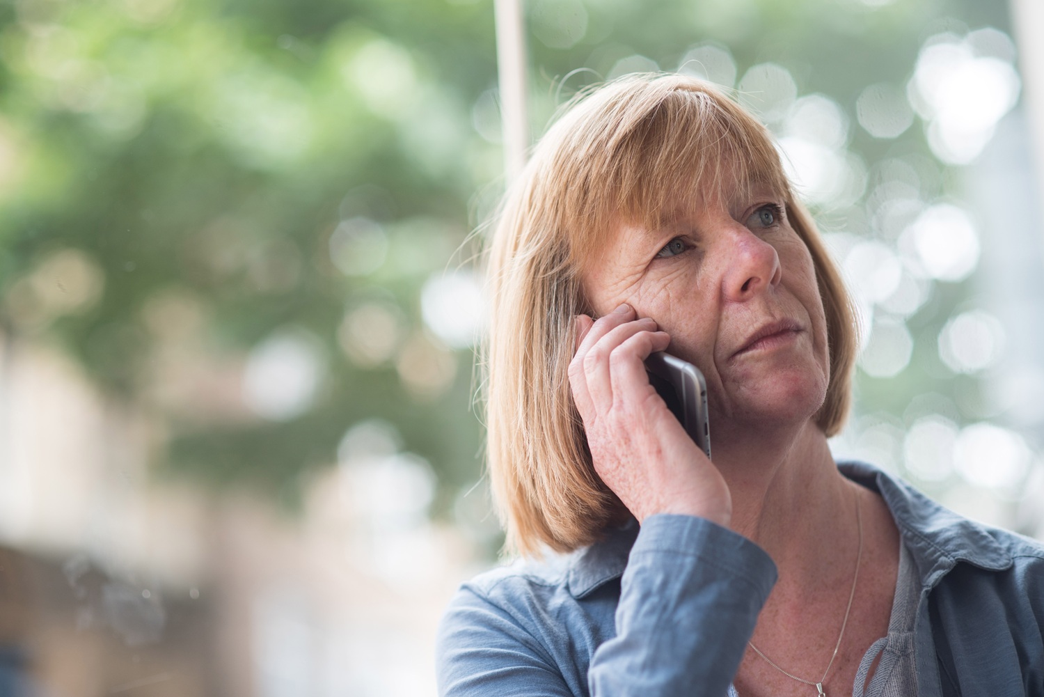 Meningitis Research Foundation Ambassador Di Spalding on the phone.