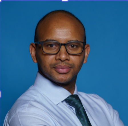 Ephrem Tekle Lemango, UNICEF Associate Director and Chief of Immunization looks at the camera with his arms folded