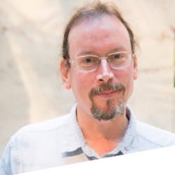 A headshot of Professor Ray Borrow.