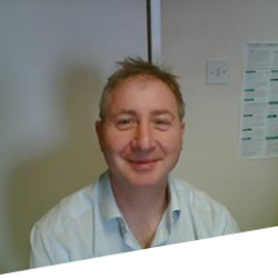 A headshot of Dr Simon Nadel.