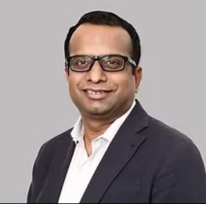 A headshot of Dr. Ravi Kumar.