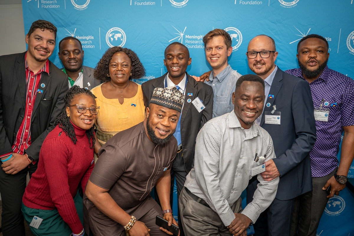 Ten CoMO members smiling in a group photo.