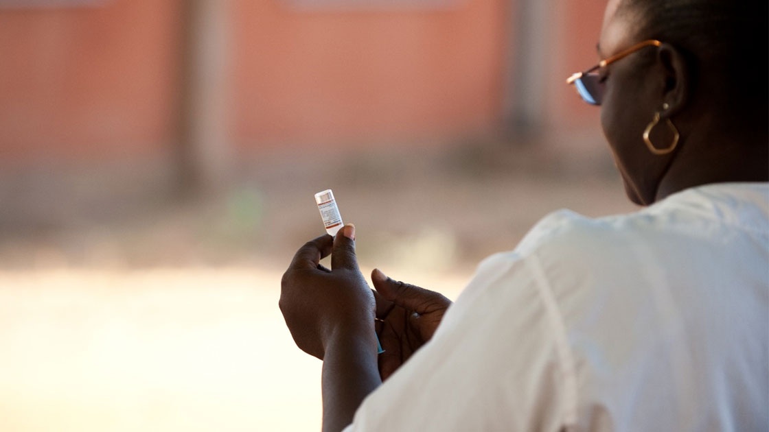A nurse preparing to administer a vaccine.