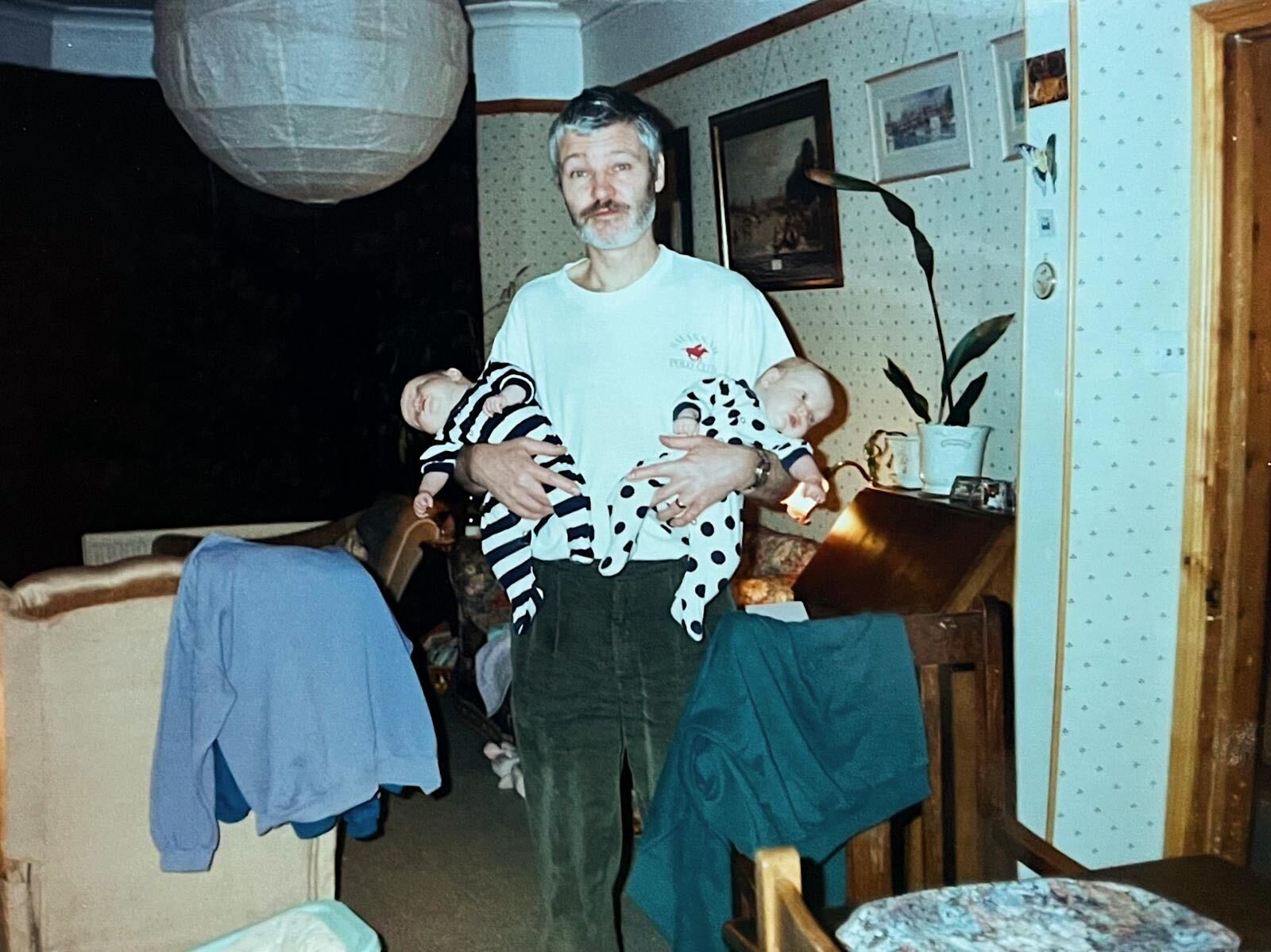 Philip March holding Polly and Felicity